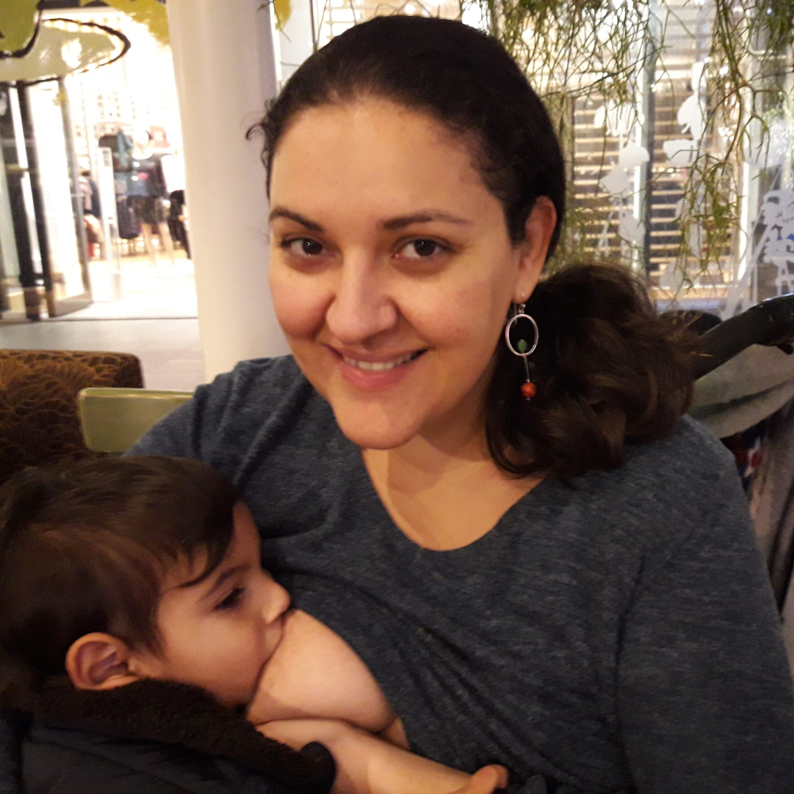 Eleni Prifti breastfeeding her child
